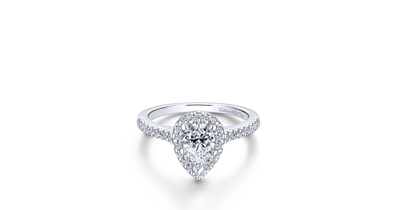 This sublime pear shaped engagement ring features pave diamonds in the halo and on the band